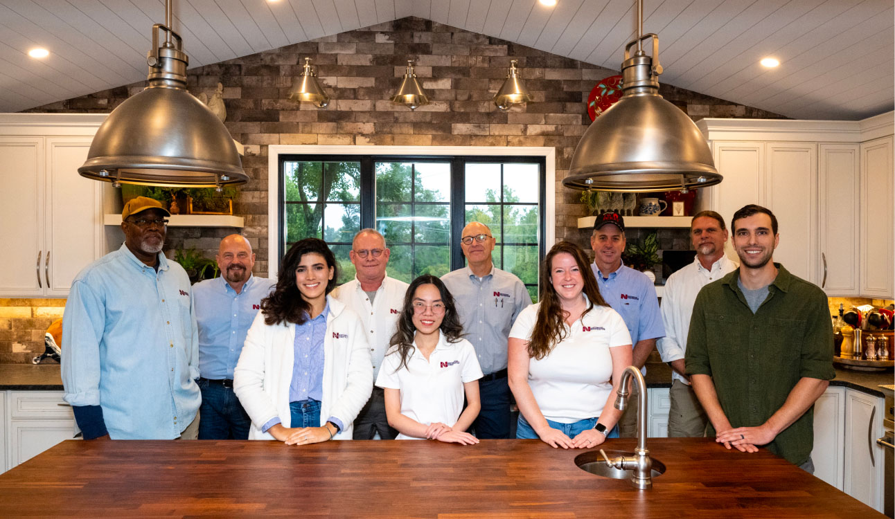 Northwood Construction Team standing in kitchen remodel