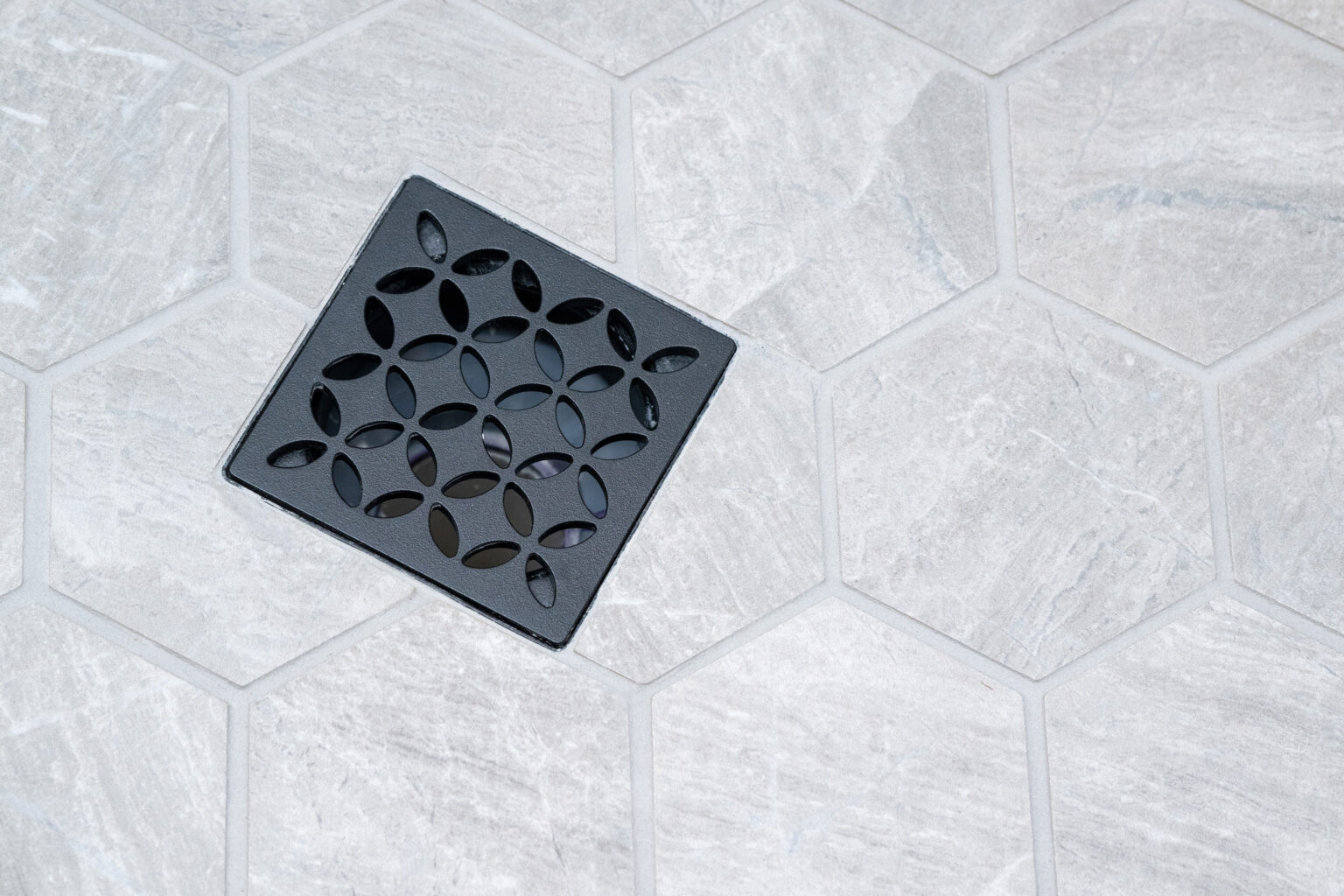 decorative shower drain in the basement bathroom
