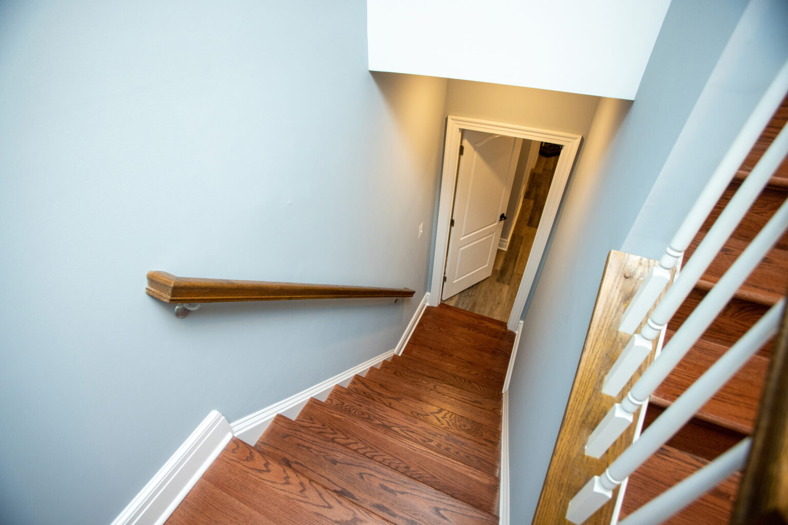stairs leading from the first floor to the basement level.