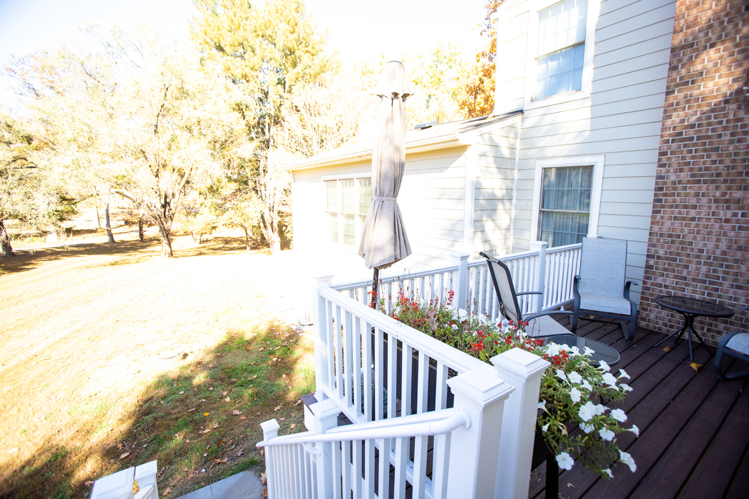 Image by Lesnick Photo Trex deck leads to the side yard.