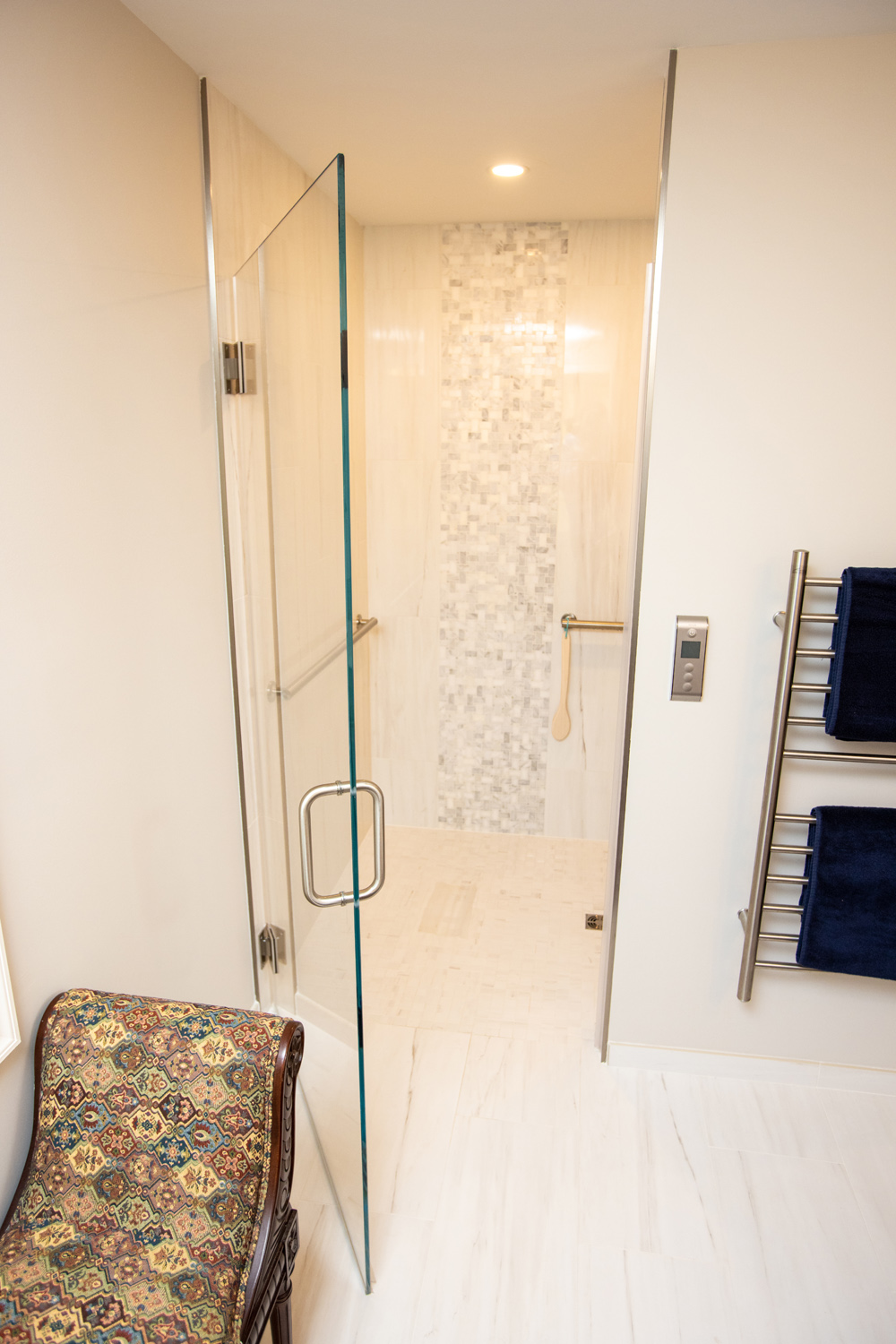 Image by Lesnick Photo curbless shower enclosure with glass door and detailed tile.