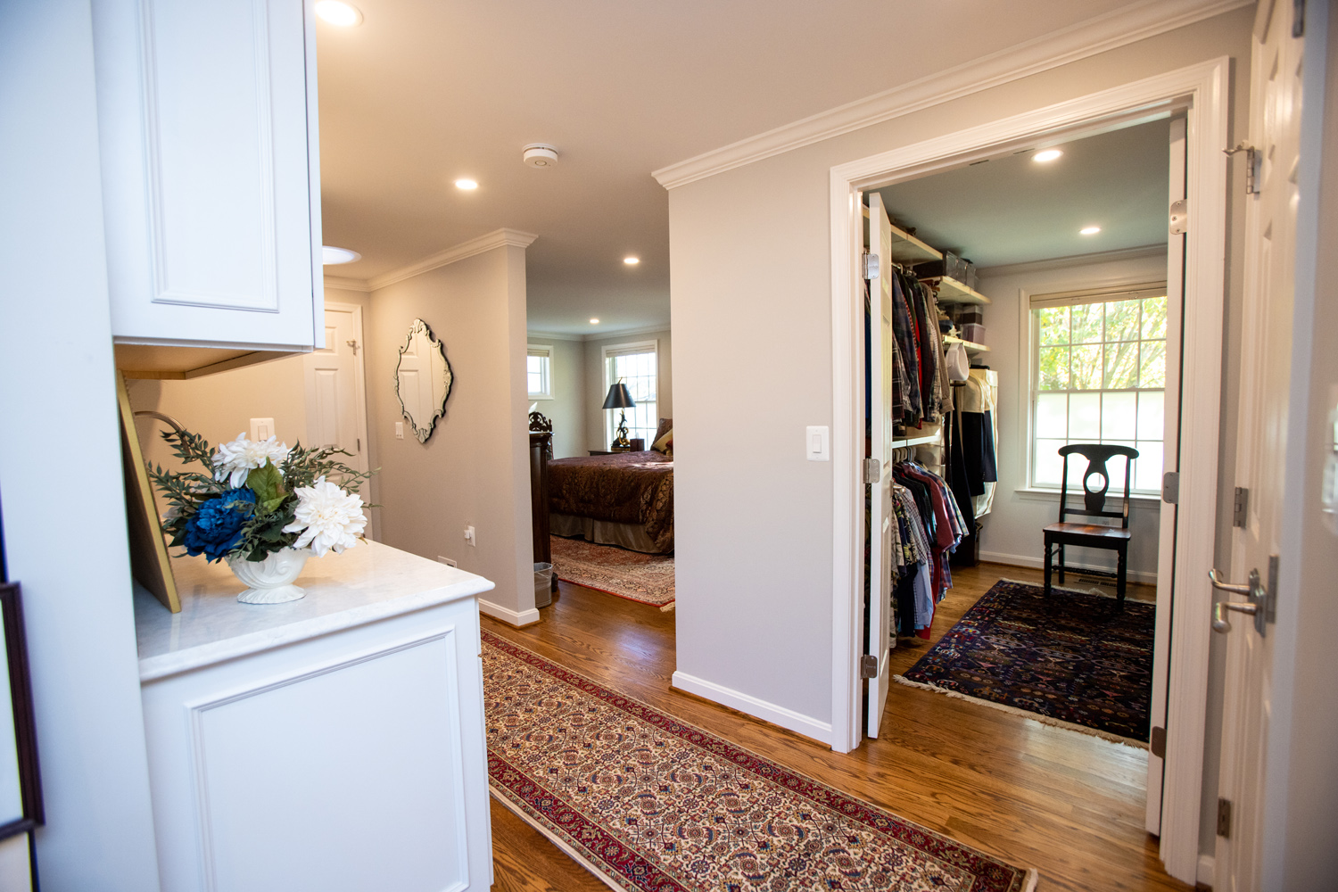 Image by Lesnick Photo A hallway leading to a bedroom with a walk in closet.