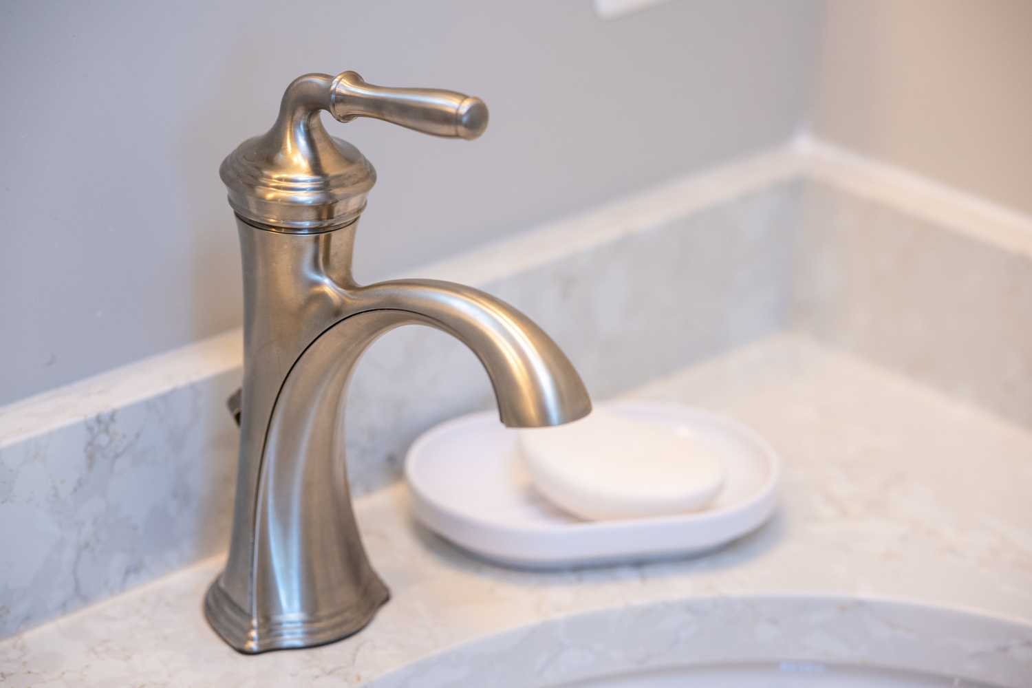 Image by Lesnick Photo A lever bathroom sink for aging in place with a soap dispenser.