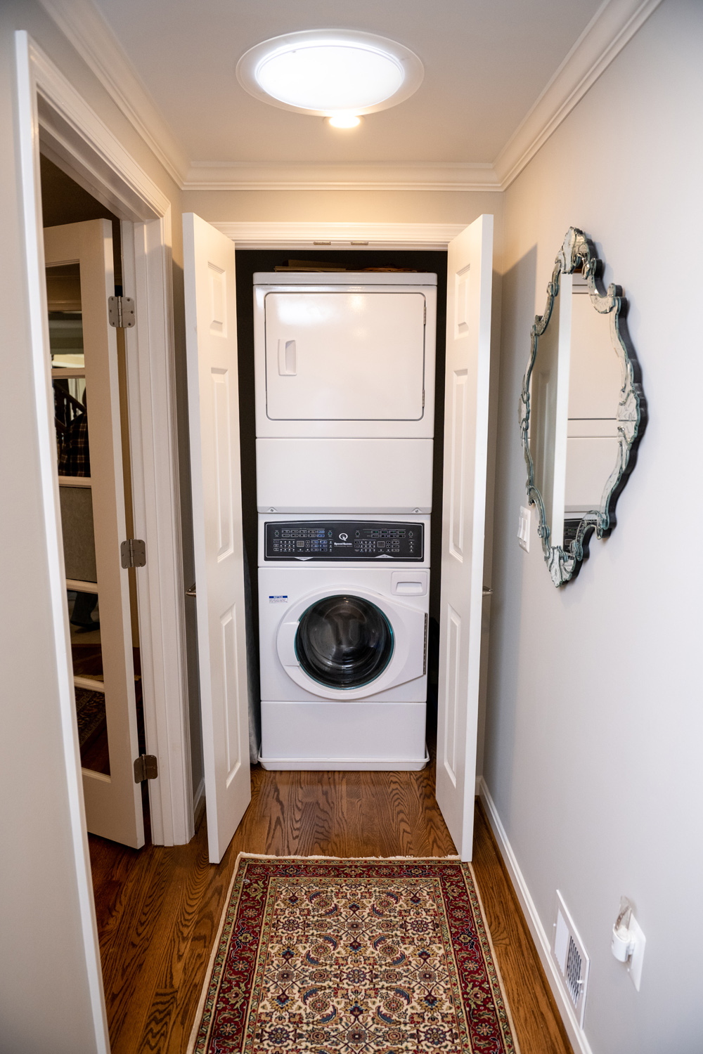 Image by Lesnick Photo stackable washer dryer unit for this master suite.