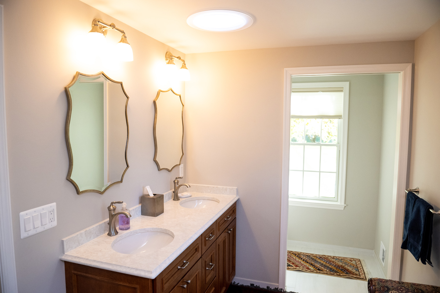 Image by Lesnick Photo A bathroom with two sinks and a mirror.