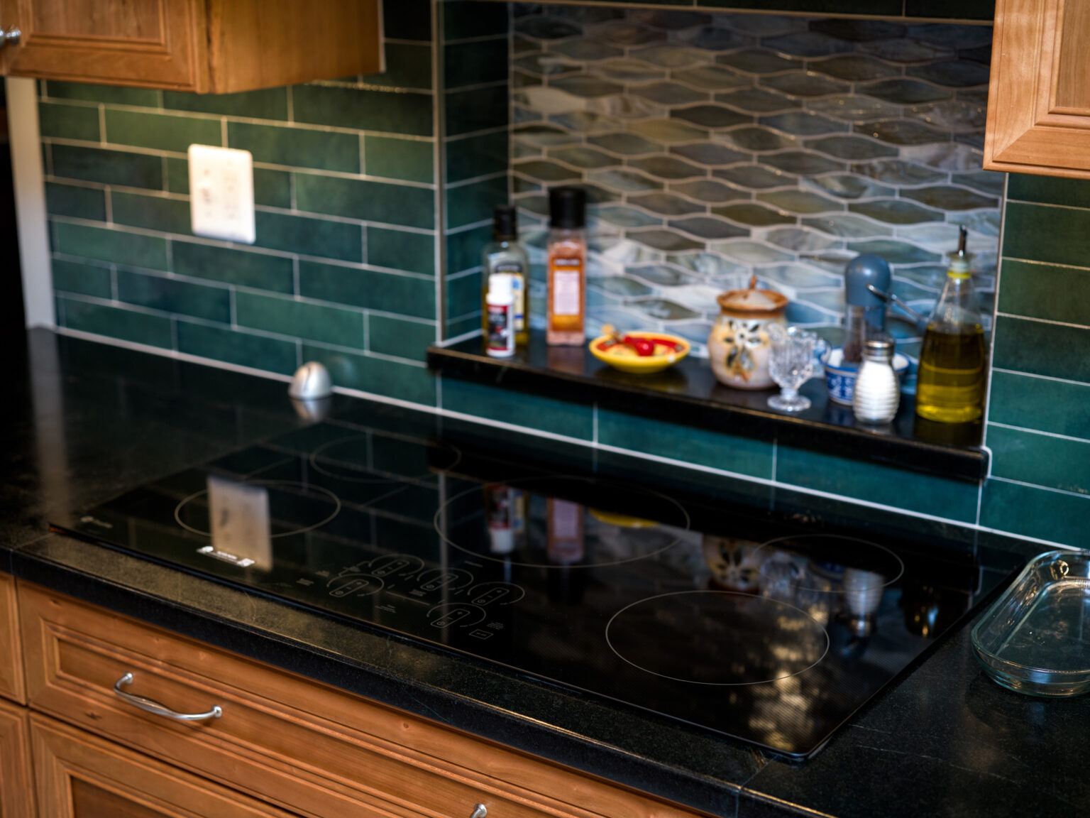 Image by Lesnick Photo Glass cooking top and soapstone countertop.