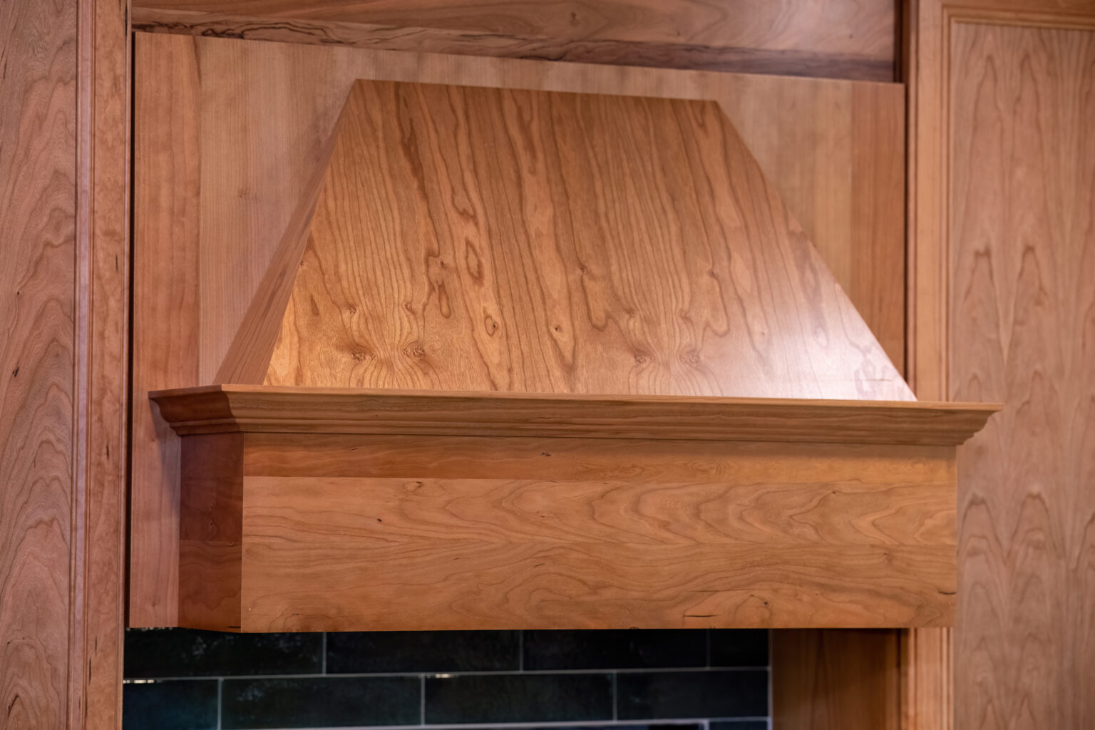 Image by Lesnick Photo decorative wooden range hood in the kitchen