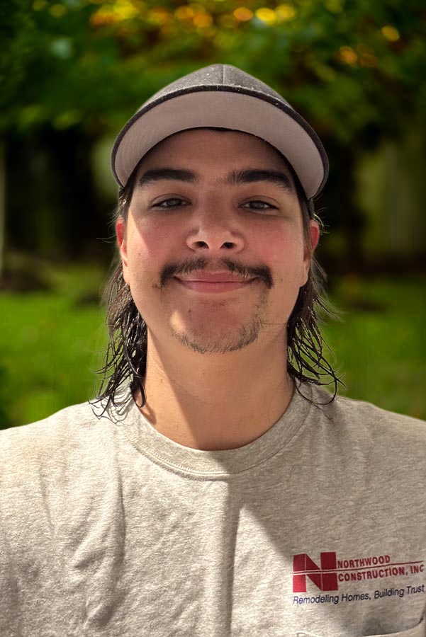 Jimmy our team in a light gray Northwood Construction t-shirt and a black cap.
